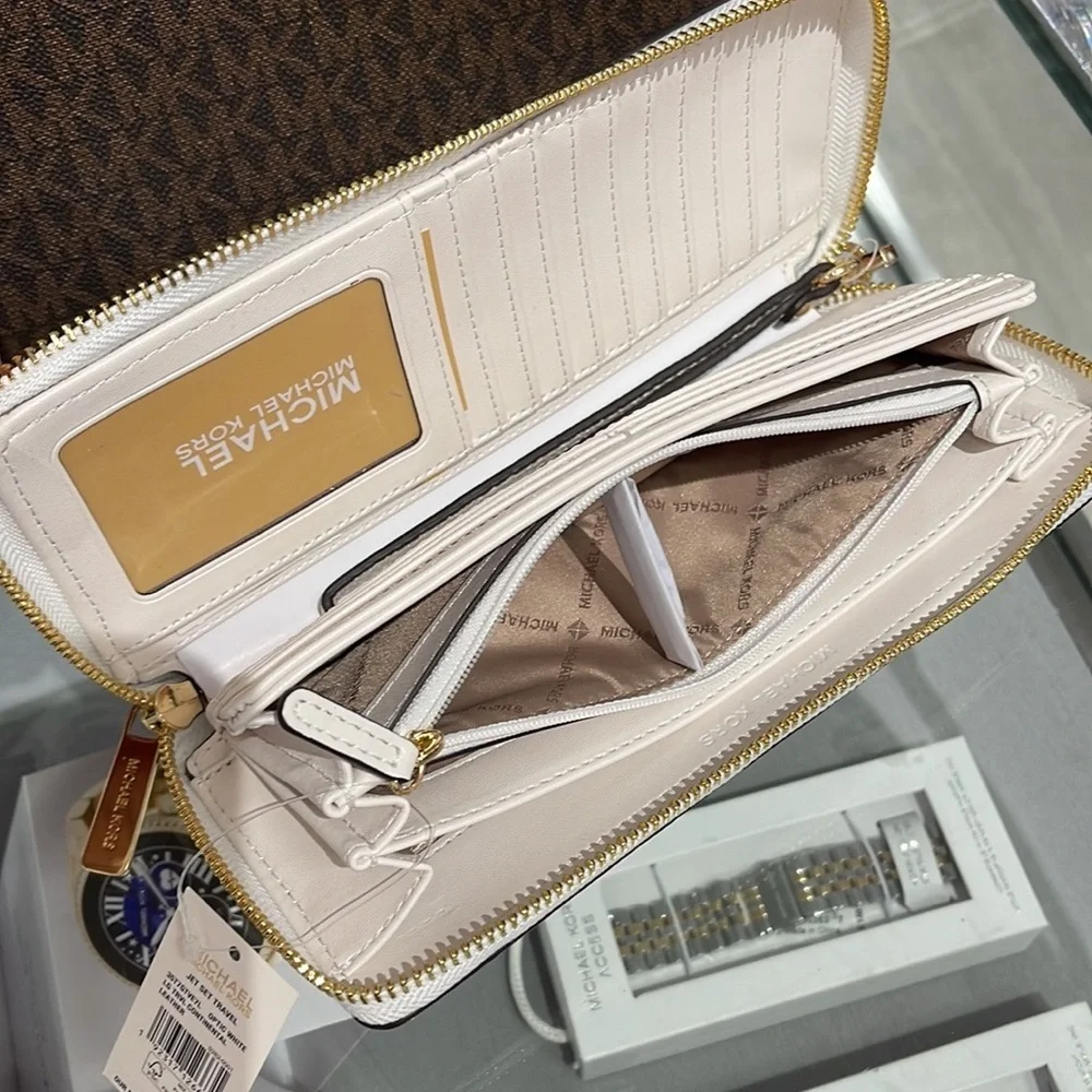 MICHAEL KORS LARGE TRAVEL CONTINENTAL WRISTLET WALLET OPTIC WHITE COLOR